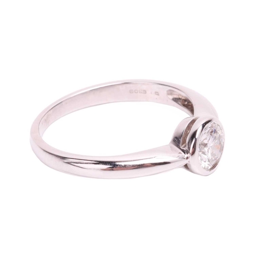 182 - A diamond solitaire ring, featuring a round brilliant diamond measuring approximately 5.2mm, with an... 