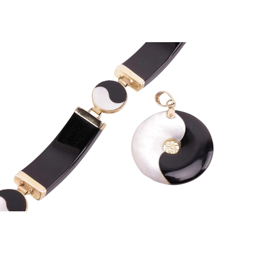 185 - A yin-yang bracelet and pendant en-suite set with mother-of-pearl and onyx; the bracelet comprising ... 