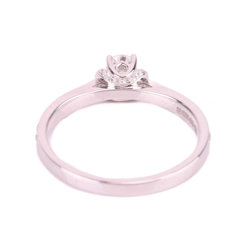 188 - A diamond solitaire ring, the central round brilliant diamond measuring approximately 3.7mm, accente... 