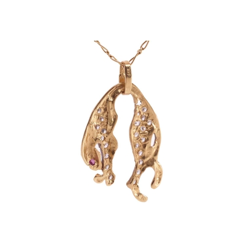 189 - A bejewelled jaguar pendant on chain, highlighted with cubic zirconias and a synthetic ruby eye, on ... 