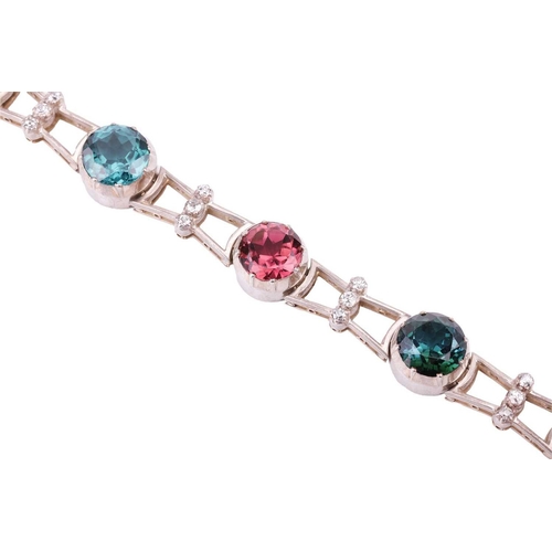 190 - A tourmaline and diamond bracelet, featuring a series of seven round tourmalines in various colours ... 