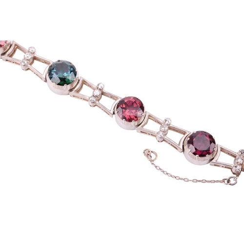 190 - A tourmaline and diamond bracelet, featuring a series of seven round tourmalines in various colours ... 