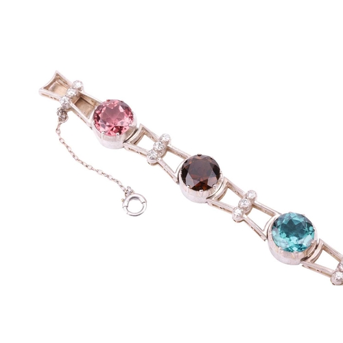 190 - A tourmaline and diamond bracelet, featuring a series of seven round tourmalines in various colours ... 