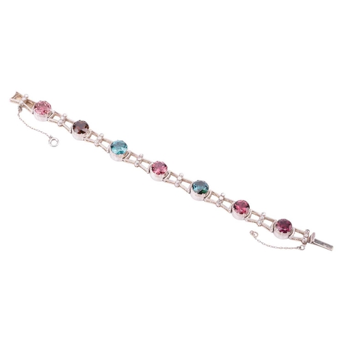 190 - A tourmaline and diamond bracelet, featuring a series of seven round tourmalines in various colours ... 