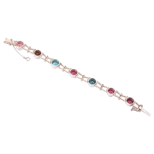 190 - A tourmaline and diamond bracelet, featuring a series of seven round tourmalines in various colours ... 