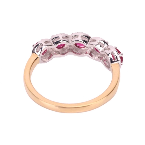 194 - A ruby and diamond cluster ring in 18ct gold, featuring five circular-cut rubies encompassed by a bo... 