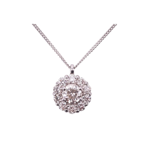 197 - A diamond cluster pendant, featuring a central round brilliant cut diamond with an estimated weight ... 