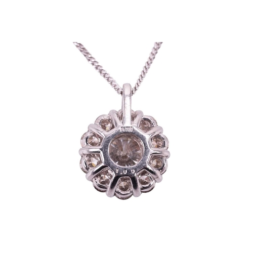 197 - A diamond cluster pendant, featuring a central round brilliant cut diamond with an estimated weight ... 