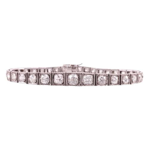 200 - An Art Deco diamond line bracelet circa 1920s, featuring a single row of cushion shape old cut diamo... 