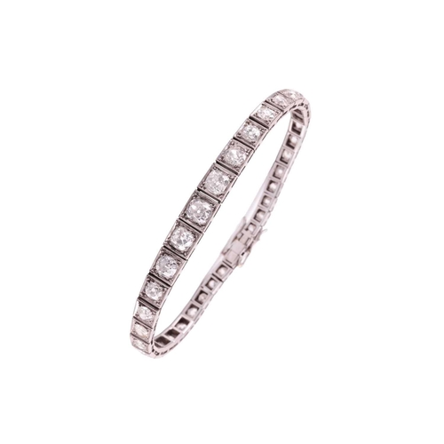 200 - An Art Deco diamond line bracelet circa 1920s, featuring a single row of cushion shape old cut diamo... 