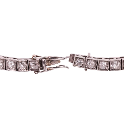 200 - An Art Deco diamond line bracelet circa 1920s, featuring a single row of cushion shape old cut diamo... 