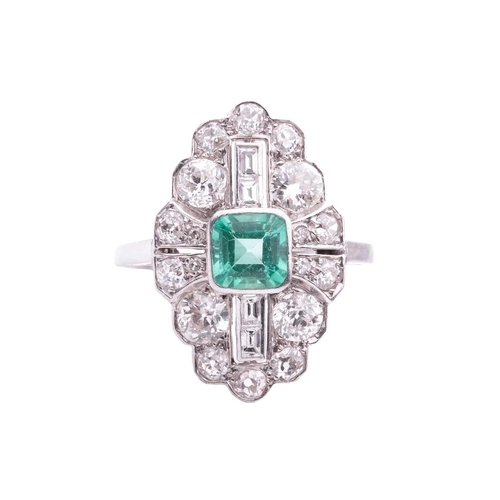 202 - An Art Deco emerald and diamond plaque ring, slightly raised at the centre with a square step-cut em... 