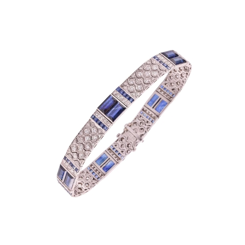 204 - An Art Deco sapphire and diamond line bracelet by Charles Holl, circa 1930, of highly flexible desig... 