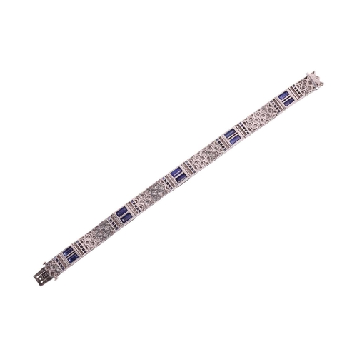 204 - An Art Deco sapphire and diamond line bracelet by Charles Holl, circa 1930, of highly flexible desig... 