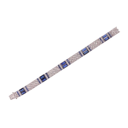 204 - An Art Deco sapphire and diamond line bracelet by Charles Holl, circa 1930, of highly flexible desig... 