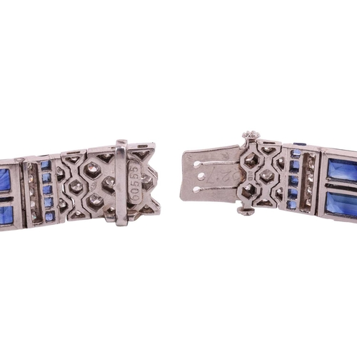 204 - An Art Deco sapphire and diamond line bracelet by Charles Holl, circa 1930, of highly flexible desig... 