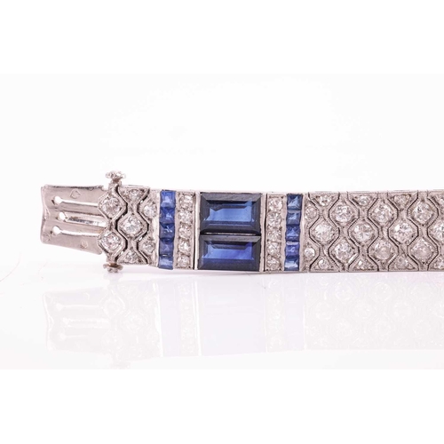 204 - An Art Deco sapphire and diamond line bracelet by Charles Holl, circa 1930, of highly flexible desig... 