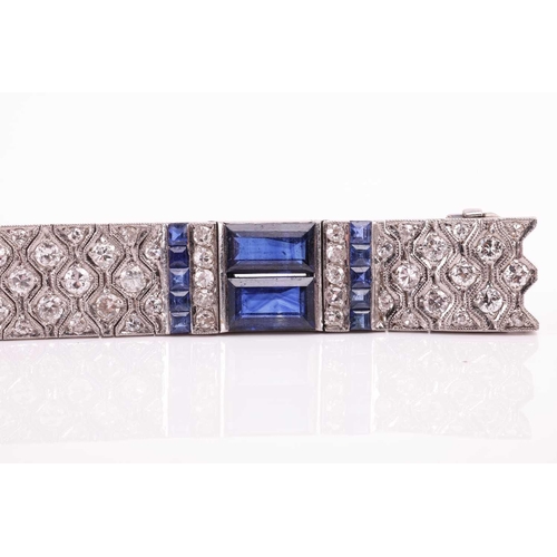 204 - An Art Deco sapphire and diamond line bracelet by Charles Holl, circa 1930, of highly flexible desig... 