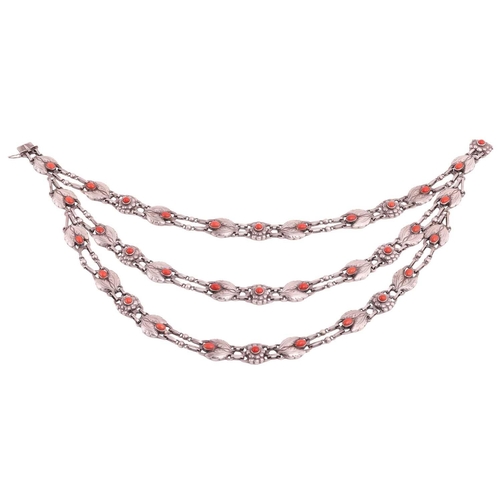 208 - Georg Jensen - a triple-strand floral necklace set with coral, comprising repoussé links in the form... 