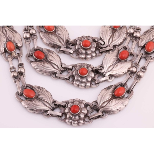 208 - Georg Jensen - a triple-strand floral necklace set with coral, comprising repoussé links in the form... 