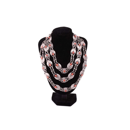 208 - Georg Jensen - a triple-strand floral necklace set with coral, comprising repoussé links in the form... 