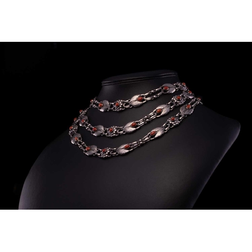 208 - Georg Jensen - a triple-strand floral necklace set with coral, comprising repoussé links in the form... 