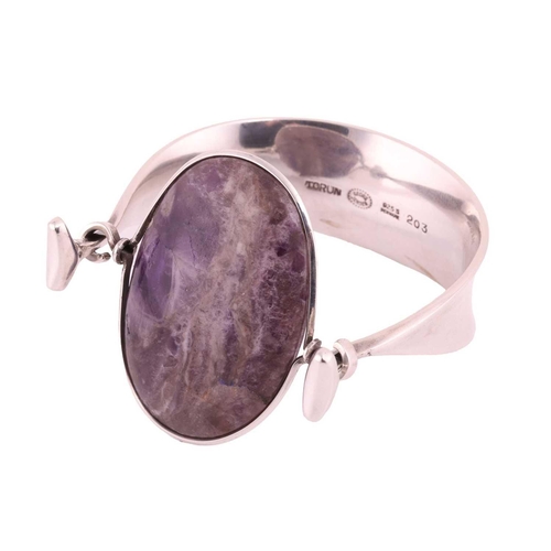 212 - Georg Jensen - 'Arm Ring' with amethyst, a tension clamp opening bangle with an oval panel of an opa... 