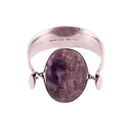 212 - Georg Jensen - 'Arm Ring' with amethyst, a tension clamp opening bangle with an oval panel of an opa... 