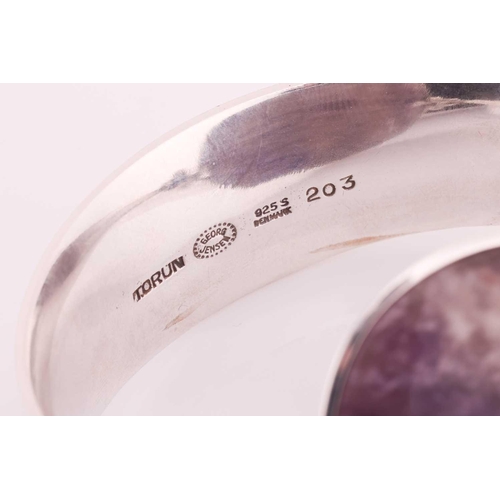 212 - Georg Jensen - 'Arm Ring' with amethyst, a tension clamp opening bangle with an oval panel of an opa... 