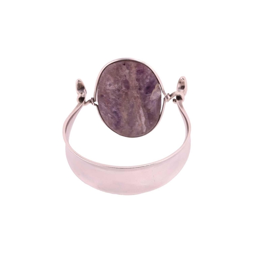 212 - Georg Jensen - 'Arm Ring' with amethyst, a tension clamp opening bangle with an oval panel of an opa... 