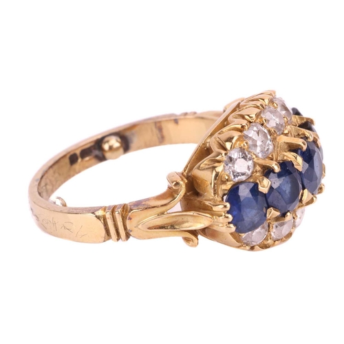 22 - A sapphire and diamond dress ring, designed as a graduated row of sapphires between rows of old cut ... 