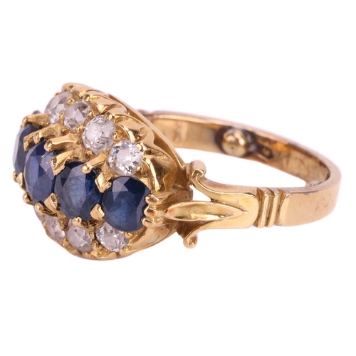 22 - A sapphire and diamond dress ring, designed as a graduated row of sapphires between rows of old cut ... 