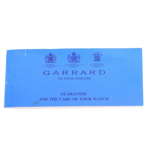 230 - A Garrard & Co 9ct Gentleman's Mechanical Wristwatch Model: 48888 Serial: S76/28 Year: 1995 Case Mat... 