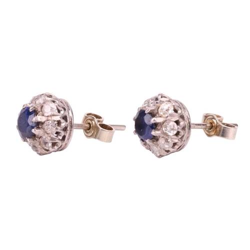 27 - A pair of sapphire and diamond cluster earrings; the circular cut sapphires in claw mounts above a b... 