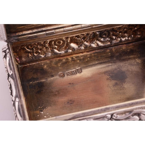 286 - A Victorian silver snuff box; rectangular, with applied cast foliate border, curved chased sides, an... 