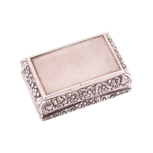 286 - A Victorian silver snuff box; rectangular, with applied cast foliate border, curved chased sides, an... 