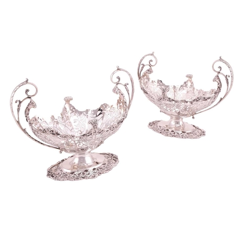 289 - A heavy silver boat form table garniture, London 1912 & 1915 by Mappin & Webb, the set comprising a ... 