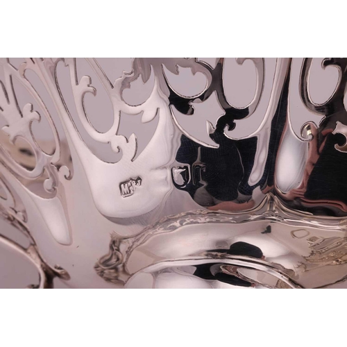 289 - A heavy silver boat form table garniture, London 1912 & 1915 by Mappin & Webb, the set comprising a ... 