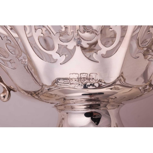 289 - A heavy silver boat form table garniture, London 1912 & 1915 by Mappin & Webb, the set comprising a ... 