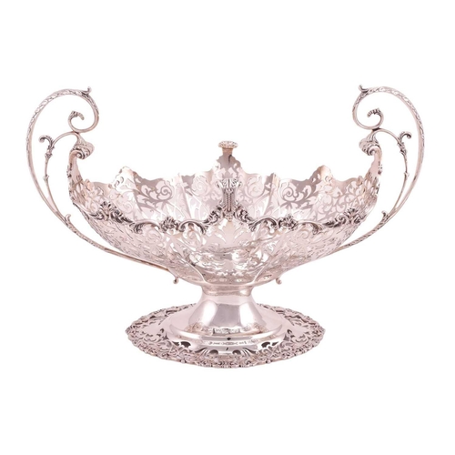 289 - A heavy silver boat form table garniture, London 1912 & 1915 by Mappin & Webb, the set comprising a ... 