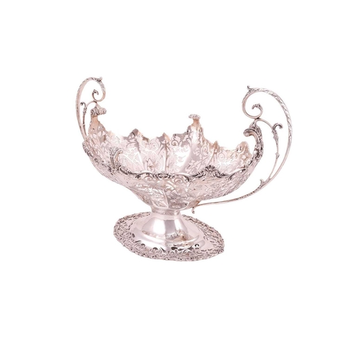 289 - A heavy silver boat form table garniture, London 1912 & 1915 by Mappin & Webb, the set comprising a ... 