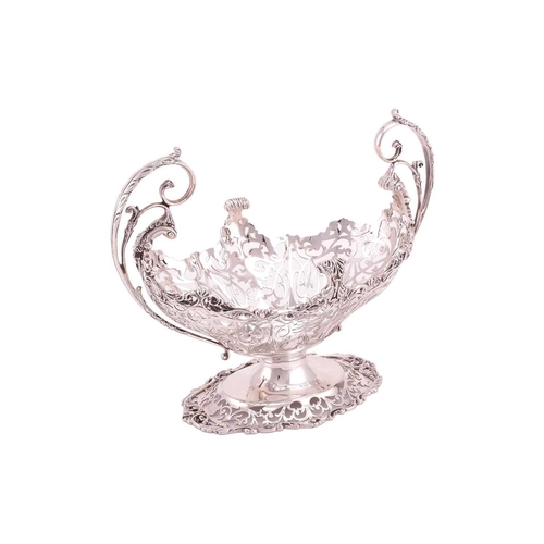 289 - A heavy silver boat form table garniture, London 1912 & 1915 by Mappin & Webb, the set comprising a ... 