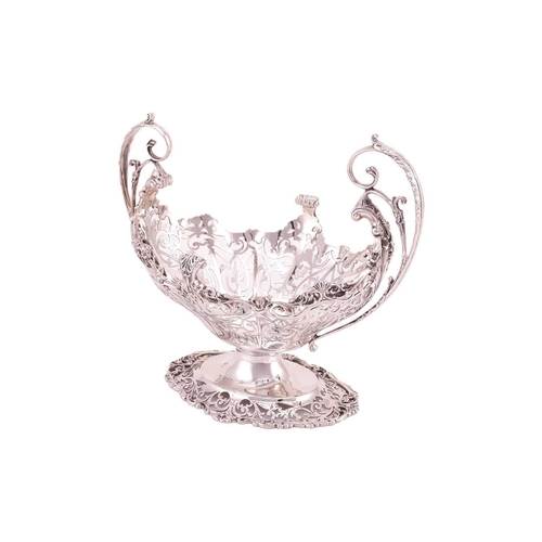 289 - A heavy silver boat form table garniture, London 1912 & 1915 by Mappin & Webb, the set comprising a ... 