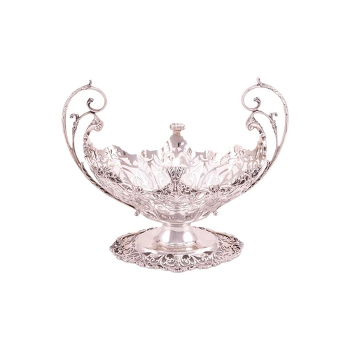 289 - A heavy silver boat form table garniture, London 1912 & 1915 by Mappin & Webb, the set comprising a ... 