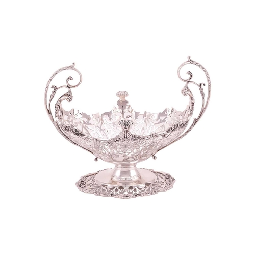 289 - A heavy silver boat form table garniture, London 1912 & 1915 by Mappin & Webb, the set comprising a ... 