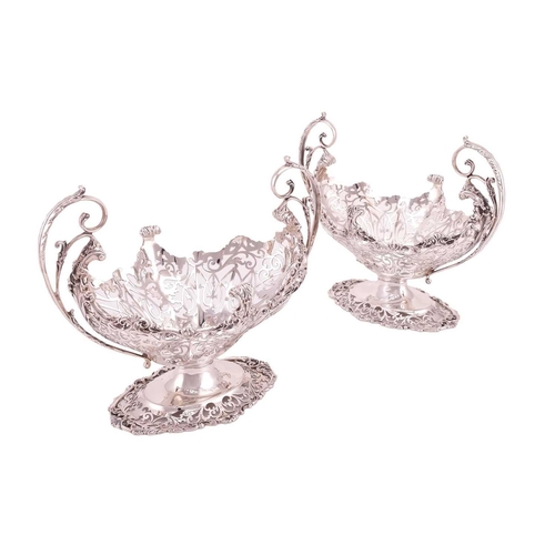 289 - A heavy silver boat form table garniture, London 1912 & 1915 by Mappin & Webb, the set comprising a ... 