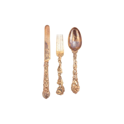 299 - A Victorian silver gilt three-piece Christening set; the cast terminals decorated with intertwined f... 