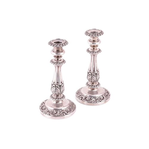 301 - A pair of George IV silver candlesticks, by S C Younge & Co., Sheffield 1823, each cast and ornated ... 