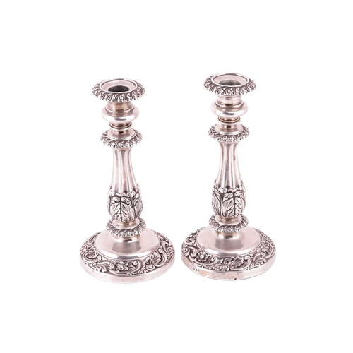 301 - A pair of George IV silver candlesticks, by S C Younge & Co., Sheffield 1823, each cast and ornated ... 