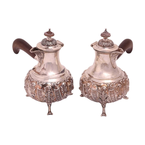 305 - A pair of Edwardian silver Cafe Aut Lait pots, London 1904 by Goldsmiths Company, each with hinged d... 